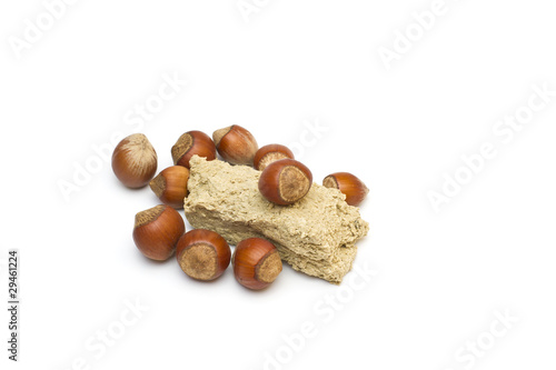 Halvah and filbert. Composition on white background