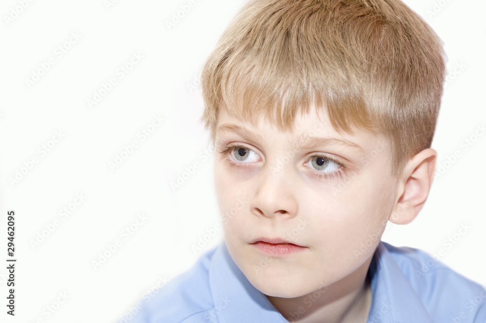 Portrait of young boy looking away from camera Portrait of young boy looking away from camera