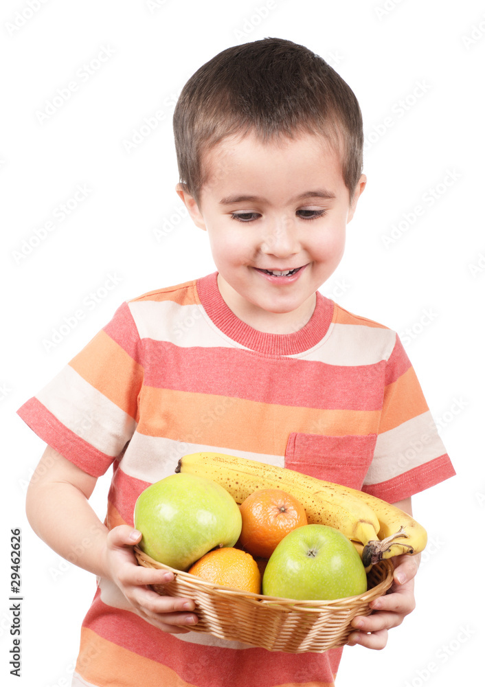 Little boy holding apples tangerines and banana Little boy holding apples tangerines and banana