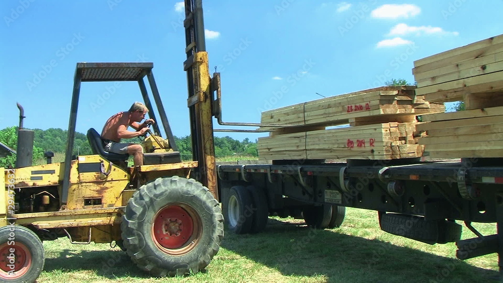 Forklift Unloading Construction Lumber 02 Forklift Unloading Construction Lumber 02