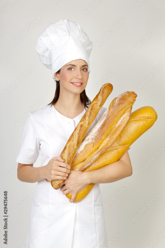 Bäckerin mit Baguettes und Brot Bäckerin mit Baguettes und Brot