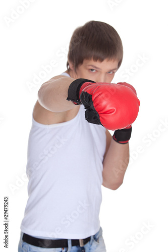 Sporty man in red fighting gloves.