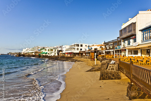 promenade of scenic Playa Blanca with seaside in the morning photo