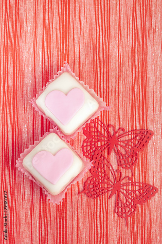 festive pink cupcakes heart shaped with red butterfly and red s