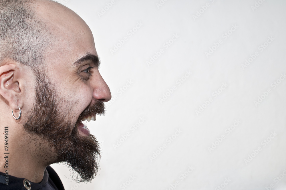 Obraz premium bearded man in profile that laughs