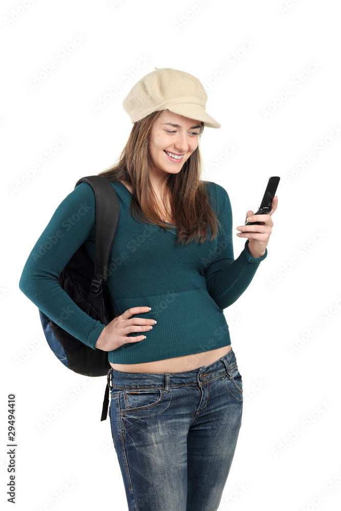 Beautiful girl sending a message by cell phone Beautiful girl sending a message by cell phone
