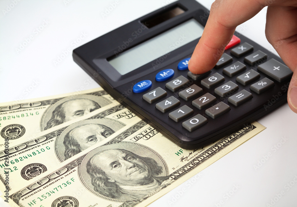 Calculator and money - accounting concept Calculator and money - accounting concept