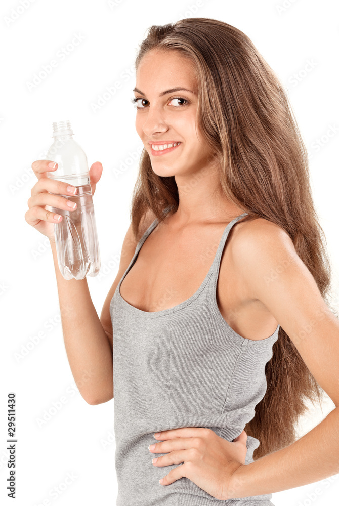 Young smiling brunette lady with bottle of mineral water Young smiling brunette lady with bottle of mineral water