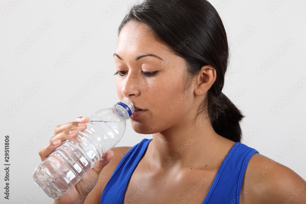 Girl feeling thirsty after a hard work out Girl feeling thirsty after a hard work out
