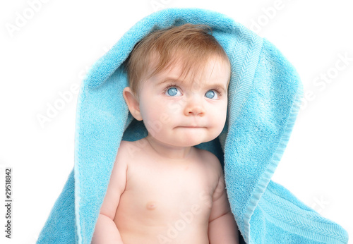 Young Baby Under Blue Towel on White