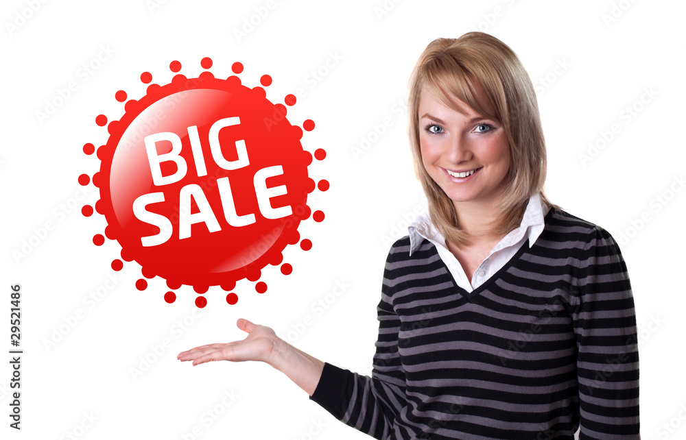 Young happy businesswoman presenting big sale sign on her hand Young happy businesswoman presenting big sale sign on her hand