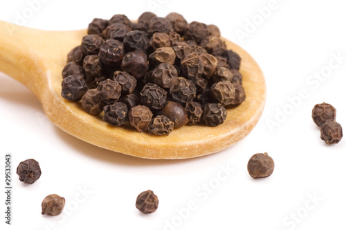 Black Peppercorns on a wooden spoon