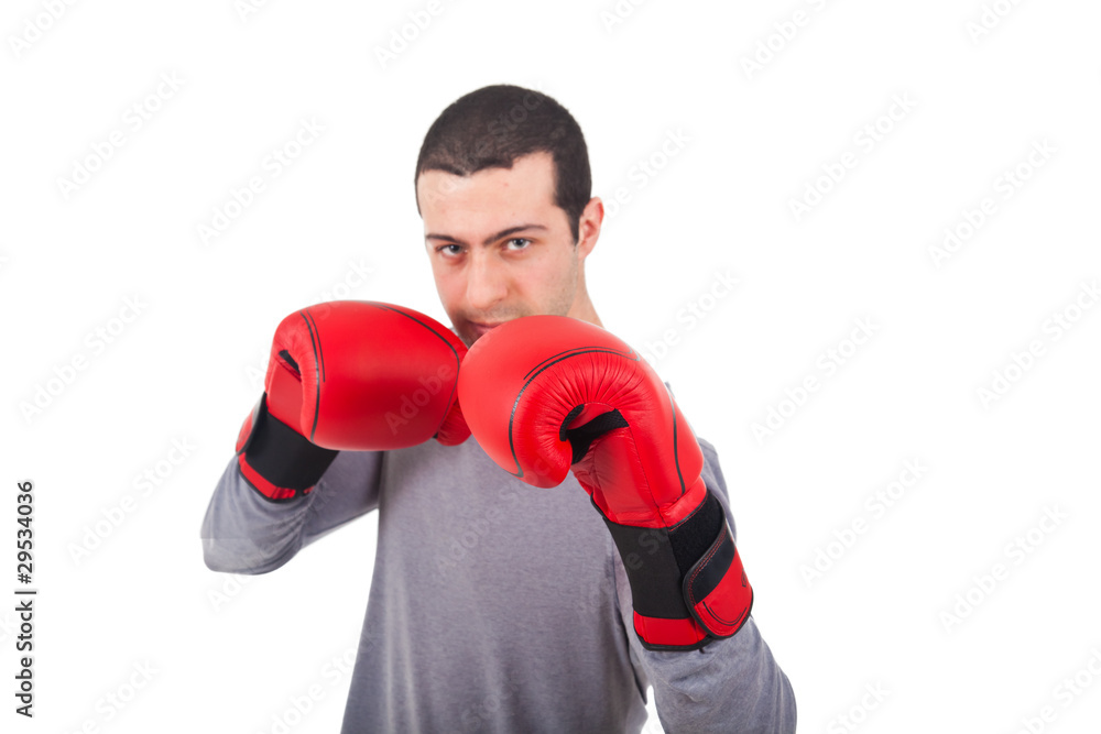 Young man with boxing gloves isolated on white Young man with boxing gloves isolated on white