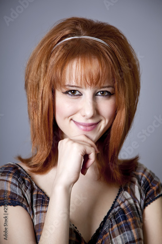 Portrait of red-haired girl. 60s style.