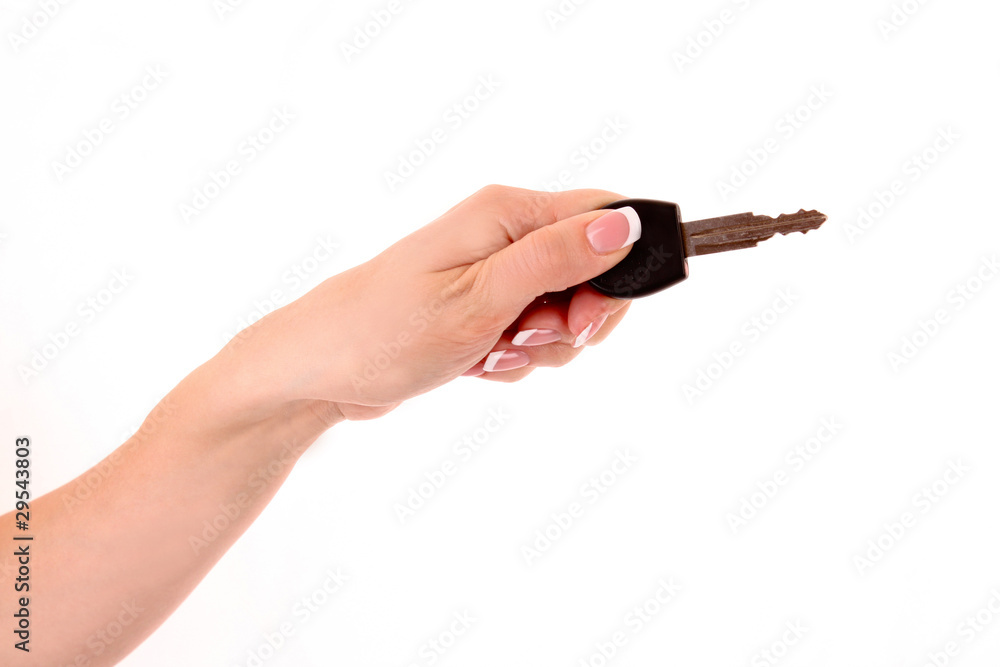 Woman hand with keys isolated on white Woman hand with keys isolated on white