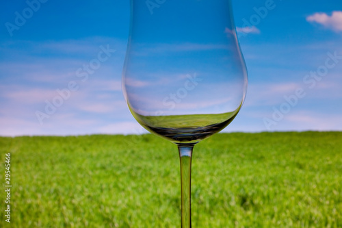 conceptually lighted wine glasson the background of the sky and