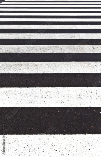 signs for pedestrian crossing are painted on the street