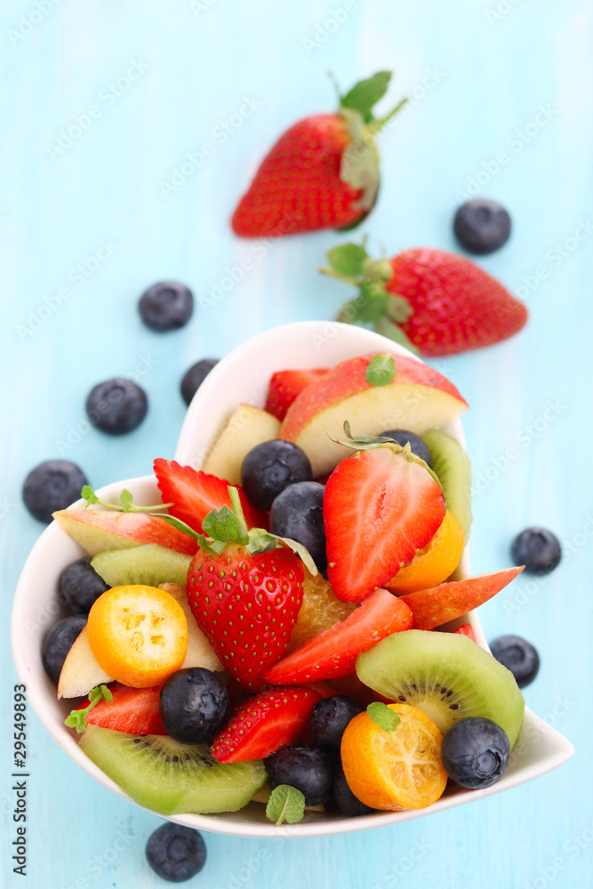 Fruity summer salad in white bowl Fruity summer salad in white bowl