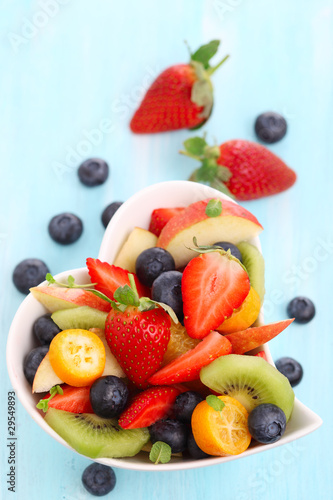 Fruity summer salad in white bowl