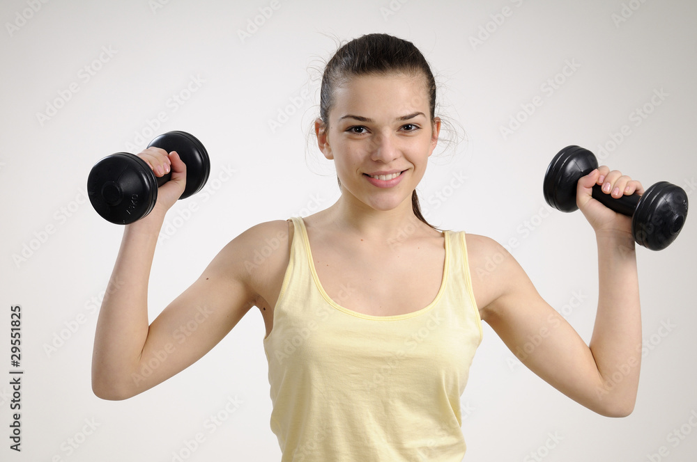 sexy fitness instructor exercising with dumbbell sexy fitness instructor exercising with dumbbell