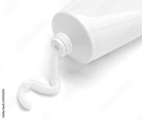 white cream tube body care product photo