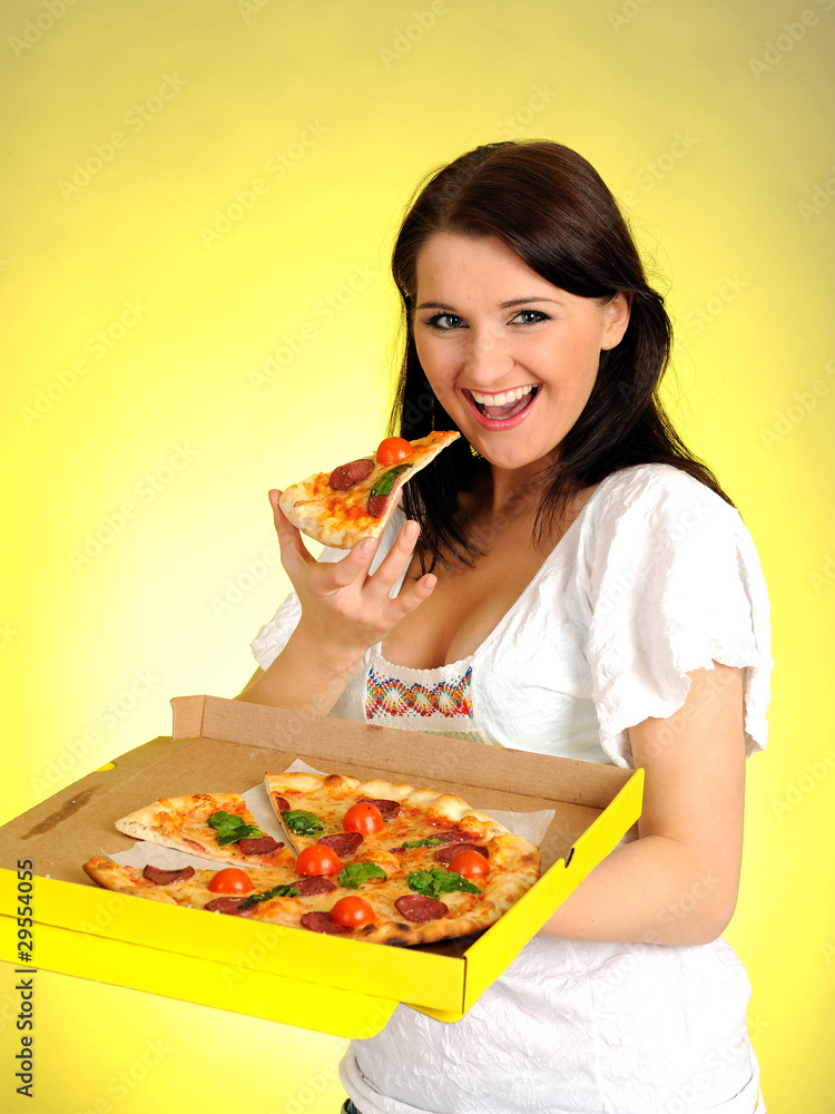Pretty young casual brunette girl eating tasty pizza Pretty young casual brunette girl eating tasty pizza