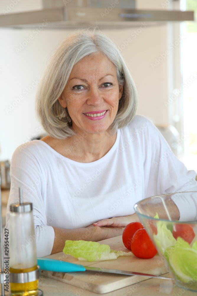 Portrait of senior woman in kitchen Portrait of senior woman in kitchen