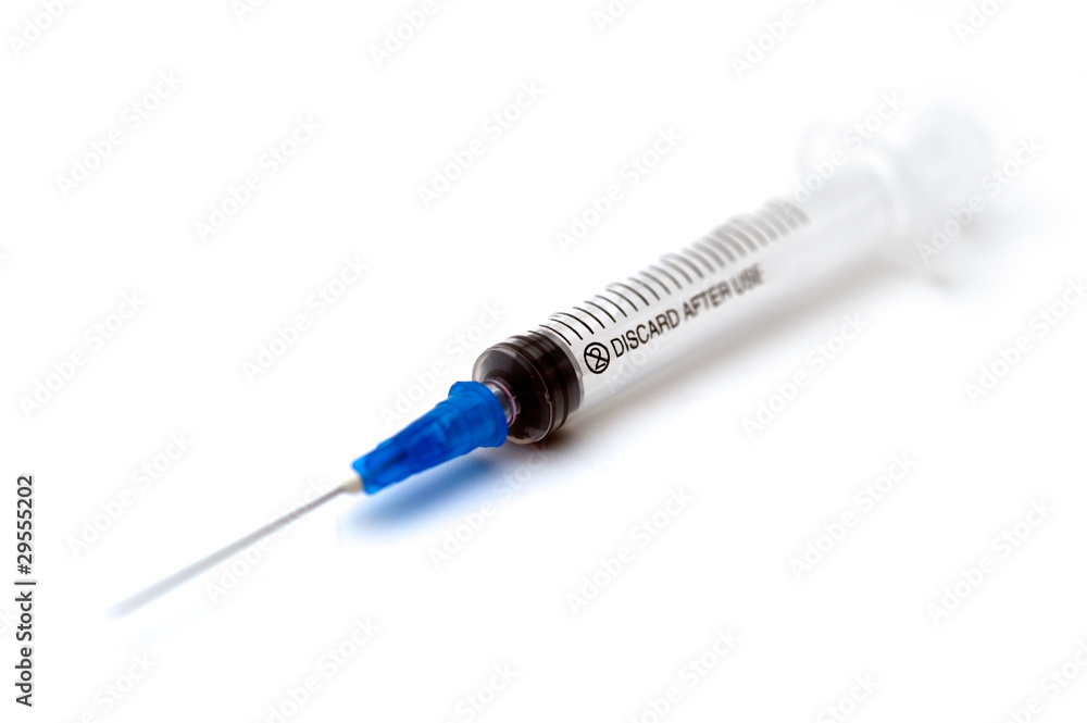 Empty disposable syringe on a white background Empty disposable syringe on a white background