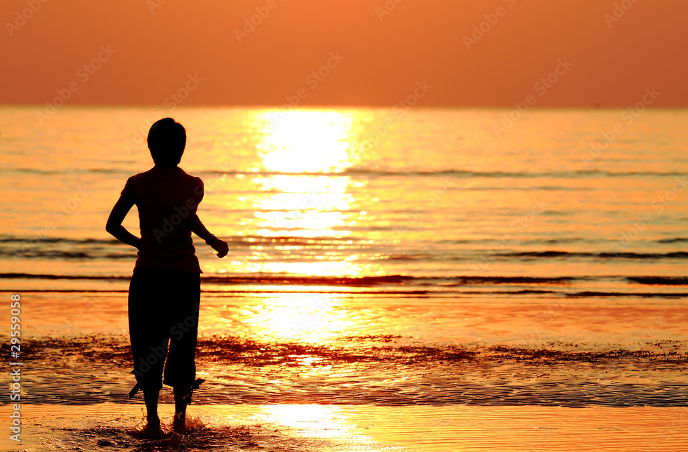 silhouette woman on tropical beach