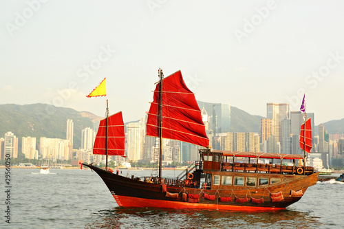 Hong Kong harbor with red sail boat