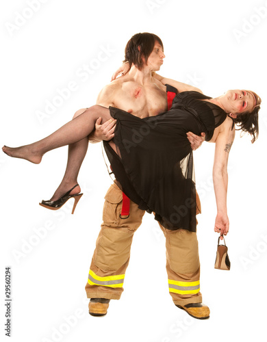 Sexy fireman rescuing pretty woman