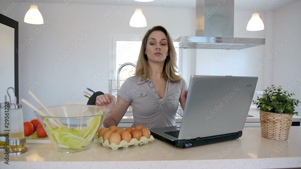 Woman checking recipe on internet Woman checking recipe on internet