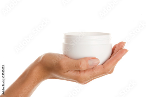 Woman's hand with jar of cream