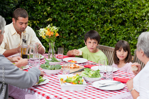 Happy family eating in the garden © WavebreakMediaMicro