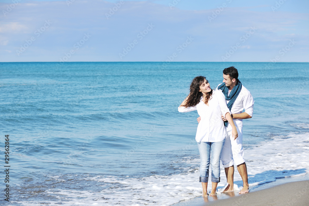 happy young couple have fun at beautiful beach happy young couple have fun at beautiful beach