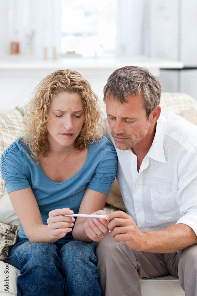Lovers looking at a pregnancy test Lovers looking at a pregnancy test