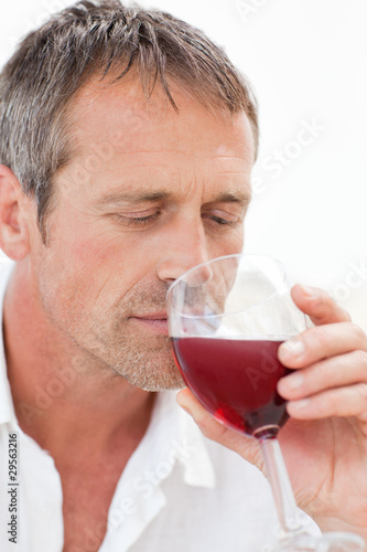 Handsome man drinking some red wine © WavebreakMediaMicro
