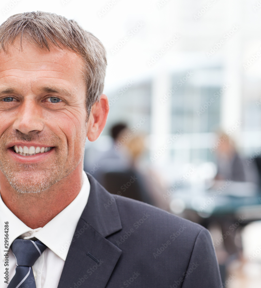 Smiling businessman in his office Smiling businessman in his office