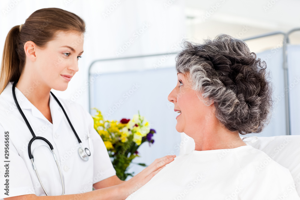 Mature woman talking with her nurse Mature woman talking with her nurse