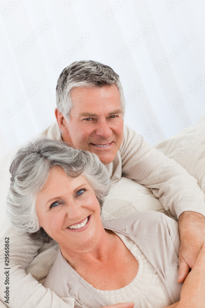Mature woman hugging her husband Mature woman hugging her husband
