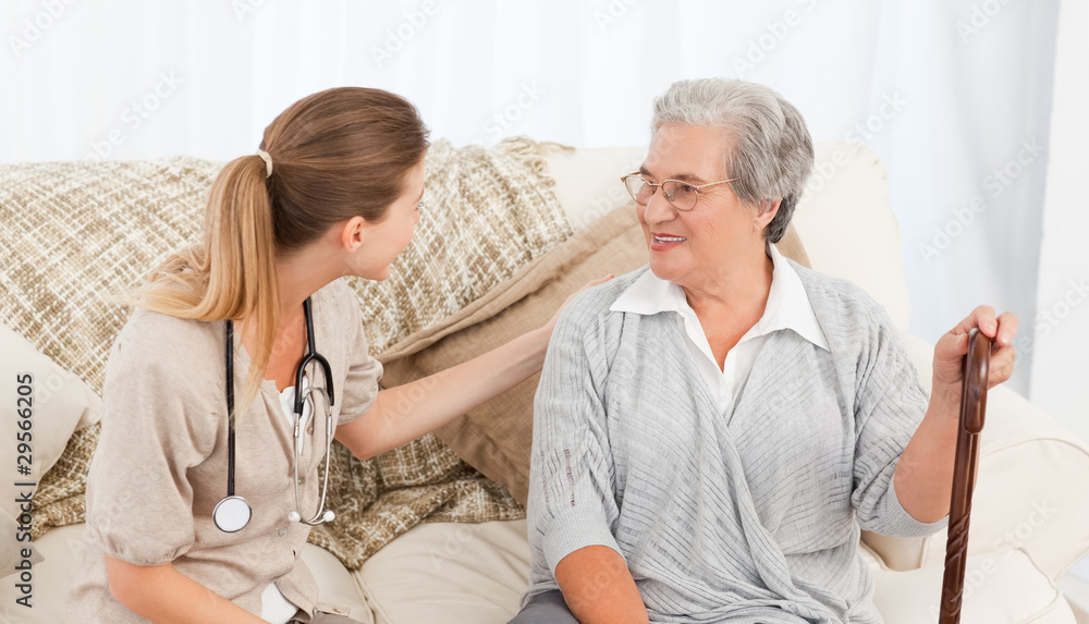 Fototapeta premium Nurse talking with her patient