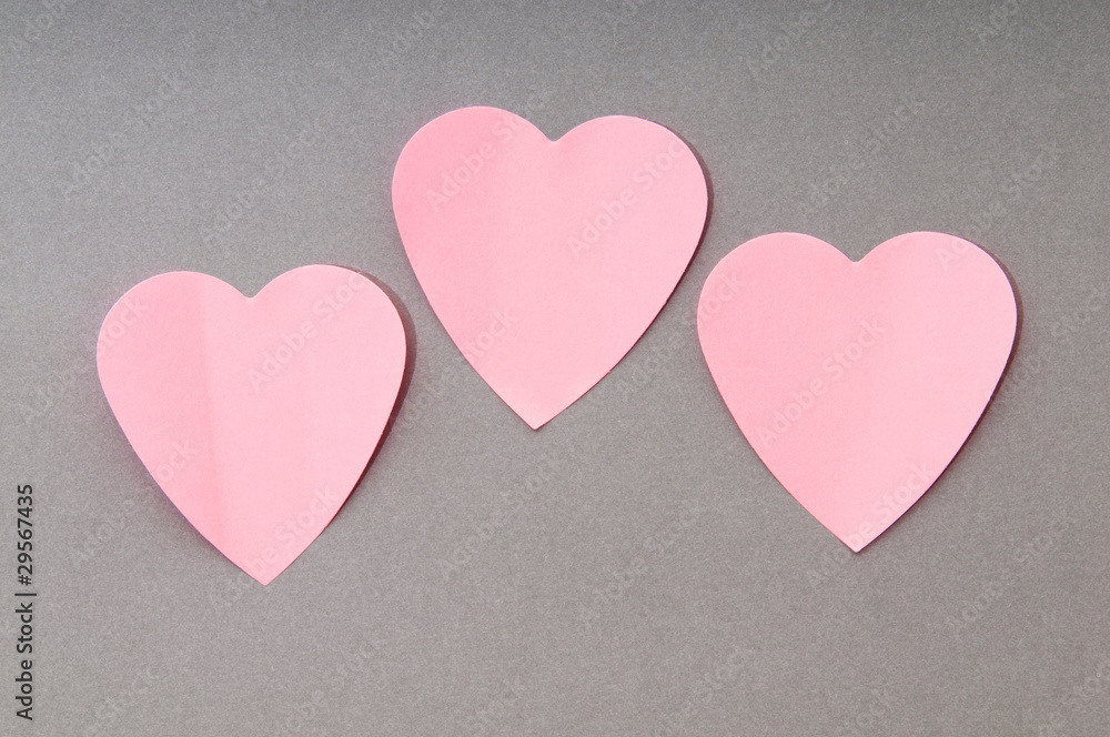 Heart shaped sticky notes on the background Heart shaped sticky notes on the background