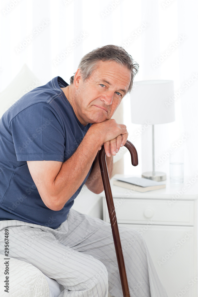 Retired man with his walking stick Retired man with his walking stick
