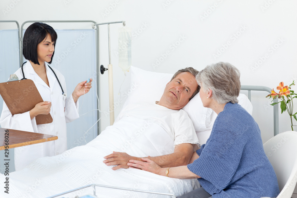 Nurse with a couple in a hospital Nurse with a couple in a hospital
