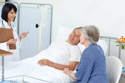 Nurse with a couple in a hospital