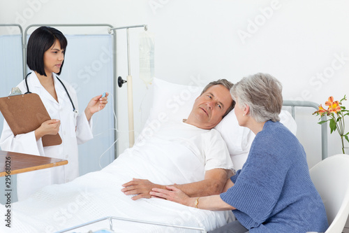 Nurse with a couple in a hospital