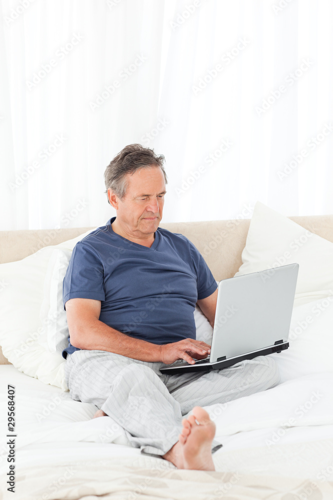 Man looking at his laptop