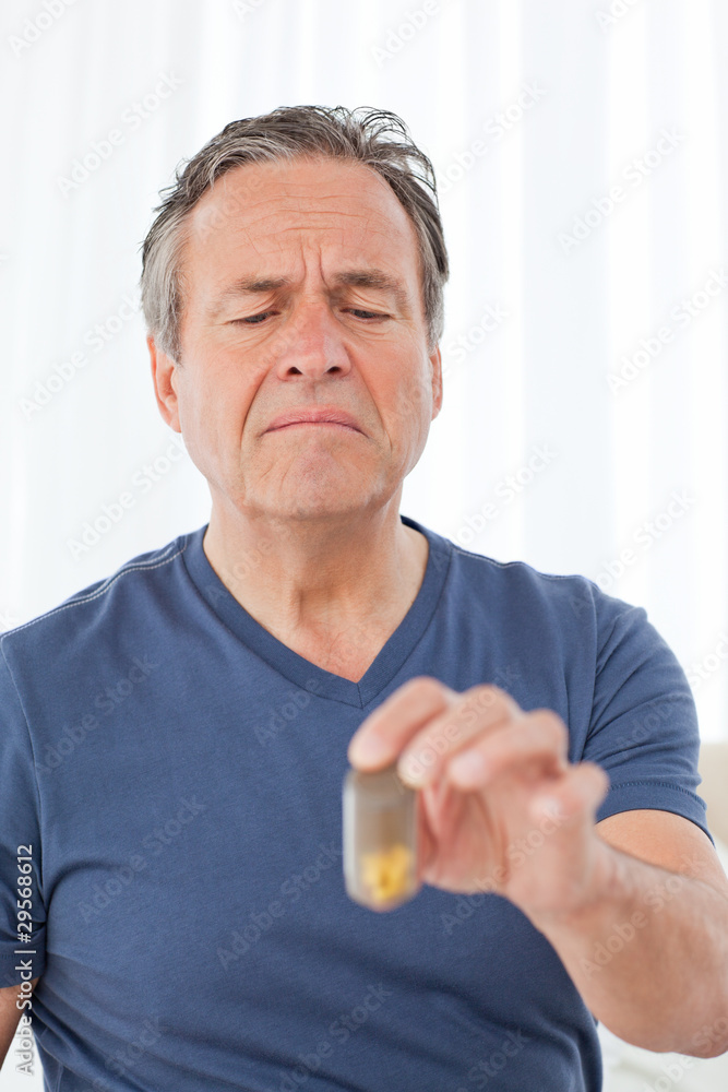 Sick man taking his pills Sick man taking his pills