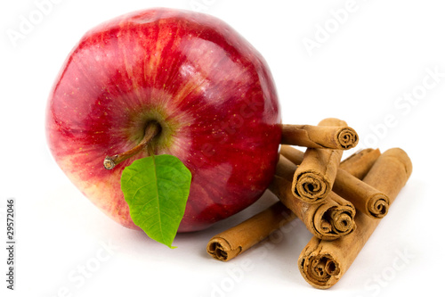Apple and cinnamon sticks isolated on white