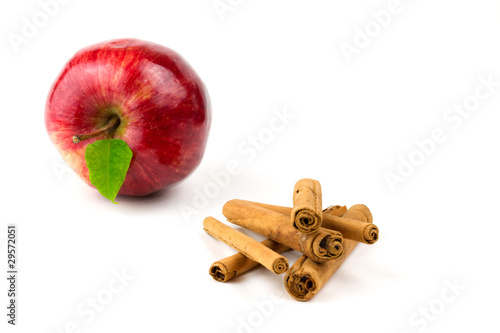 Apple and cinnamon sticks isolated on white